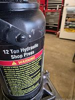 Close-up of bottle jack label showing 12-ton rating