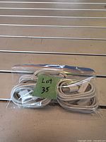 Five white cables in zip bag