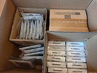 Open box showing stacked loose Z10 cases and boxed Z30 cases