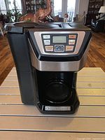 Front view of Black & Decker Mill & Brew coffee maker showing control panel and brew basket area