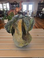 Front view showing ruffled rim and textured glaze