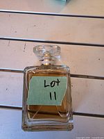 Chanel eau de parfum bottle lying on side showing stopper and liquid level