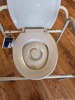 Top view of commode chair with seat and lid showing