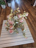 Overall view of floral chandelier on slatted surface