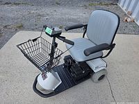 Side view of Fortress Scientific 3-wheel scooter with basket and seat