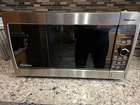 Front view of stainless Panasonic Genius Inverter microwave