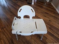 Overall view of shower bench showing seat, backrest and legs