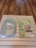 Shower curtain package and green seat cover side by side