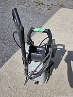 Front view showing Sundance branding, 1800 PSI label, hose reel and power cord