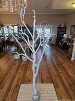 full view of vase with branch decor
