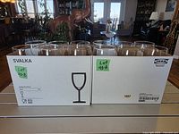 Front view of two unopened IKEA Svalka wine glass boxes