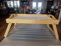 Tray with legs extended, front view