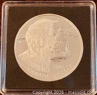 Reverse of 1995 Canada silver dollar showing fur traders and ship