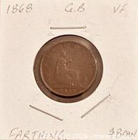 Coin reverse with seated Britannia in holder showing date 1868 and VF notation