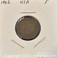 Obverse view of 1902 Indian Head cent in cardboard flip