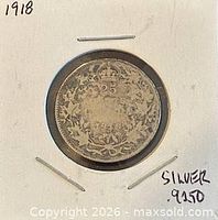 Reverse view showing 25 CENTS, maple-leaf wreath, date 1918