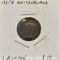 Obverse view of 1925B Swiss 1 Rappen coin in holder