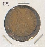 Full view of coin in holder showing Britannia reverse and date 1935