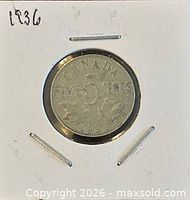 Reverse of 1936 Canada 5 cents coin showing denomination and date in holder