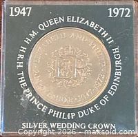 Front of holder showing reverse side of crown with date range