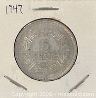 Coin in cardboard flip showing reverse with RF 5 FRANCS 1947