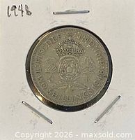 Full coin in holder, date noted, obverse visible