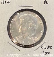 Obverse of 1964 Kennedy half dollar in flip