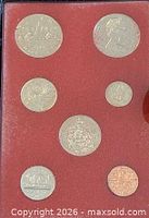 Full view of red insert showing all seven coins in case