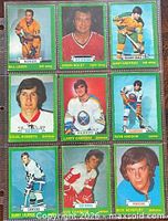 Fronts of nine 1973-74 O-Pee-Chee hockey cards in 3×3 sleeve