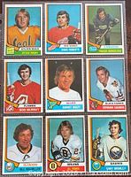 Fronts of nine 1974-75 O-Pee-Chee hockey cards in sleeve