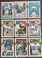 Front view of all nine Topps football cards displayed in three-by-three layout