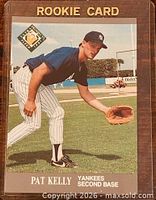 Front of Pat Kelly rookie card showing action pose, logos and card title