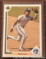 Front of 1991 Upper Deck Manny Lee card in sleeve