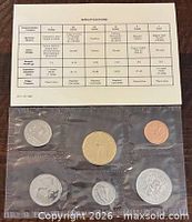 Front view of sealed six-coin set with specification card