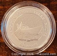 Reverse of 1992 Newfoundland 25-cent silver proof coin in capsule
