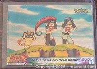 Front of card showing Team Rocket scene in sleeve