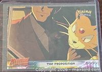 Front of card showing artwork of Giovanni and Persian, title and set logos visible