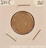 Reverse with two veteran profiles and denomination visible