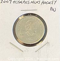 Obverse view of coin in holder showing Queen Elizabeth II effigy and date 2007