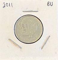 Coin in holder, year noted