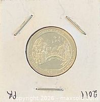 Reverse side of 2011 Chickasaw proof quarter in flip