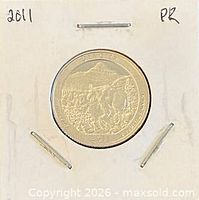 Coin in holder, obverse and part reverse visible