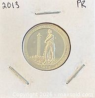 Coin in flip showing Perry’s Victory reverse