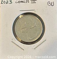 Coin encapsulated in 2x2 holder with year and BU noted