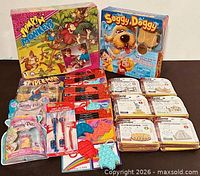 Full lot showing board games, Spider-Man pack, Twisty Petz, spinners, pop-its, World of Cubes sets