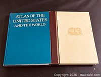 Front covers of both atlases side by side