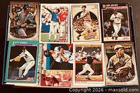 Eight baseball cards laid out including Victor Martinez, Ted Williams, Barry Bonds, Jack Morris, Tom Glavine, Wade Boggs, Babe Ruth