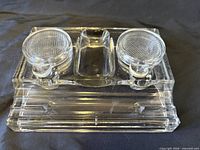 top view showing two lidded wells and pen rest