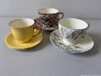 front view of all three cup and saucer sets