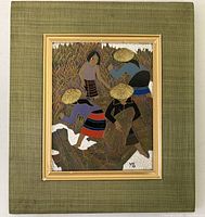 Front view of framed carved wood painting showing entire artwork and frame